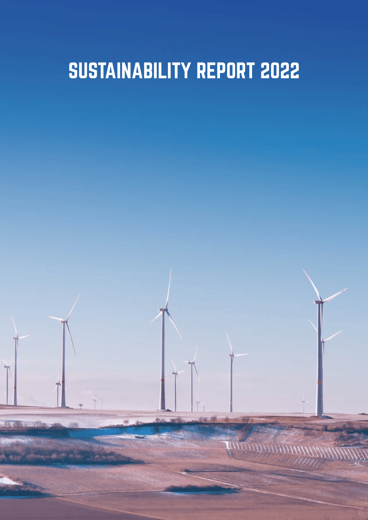 A row of wind turbines stands on a lightly snow-dusted plain beneath a clear blue gradient sky, with ‘SUSTAINABILITY REPORT 2022’ in white at the top.